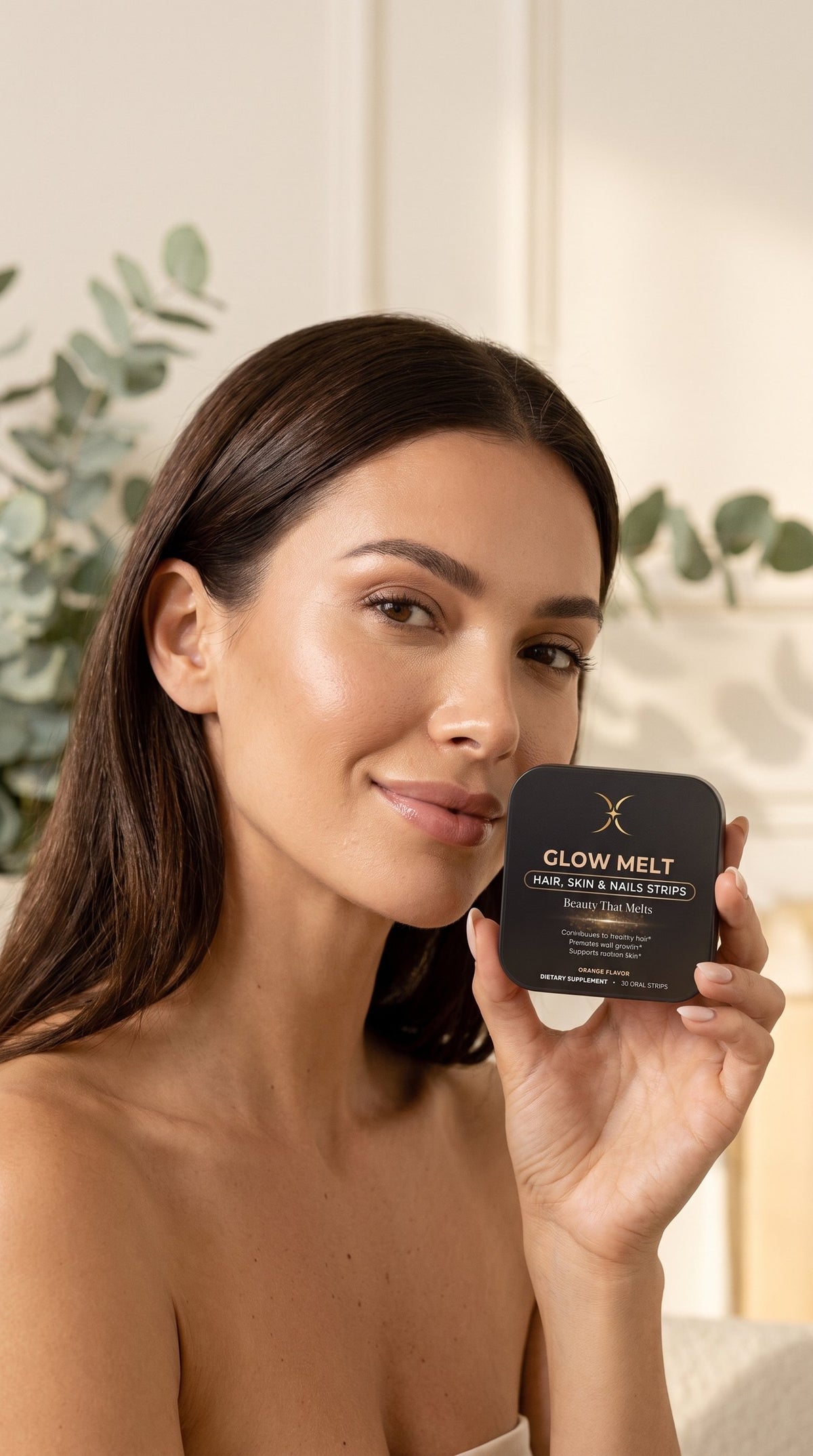 Woman smiling softly with a GLOW MELT tin by her cheek